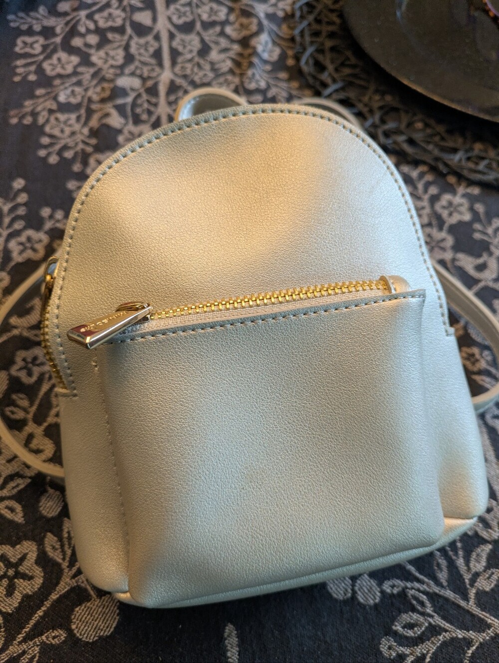 Silver Vinyl Mini Backpack ( Free With $50.09 Purchase)